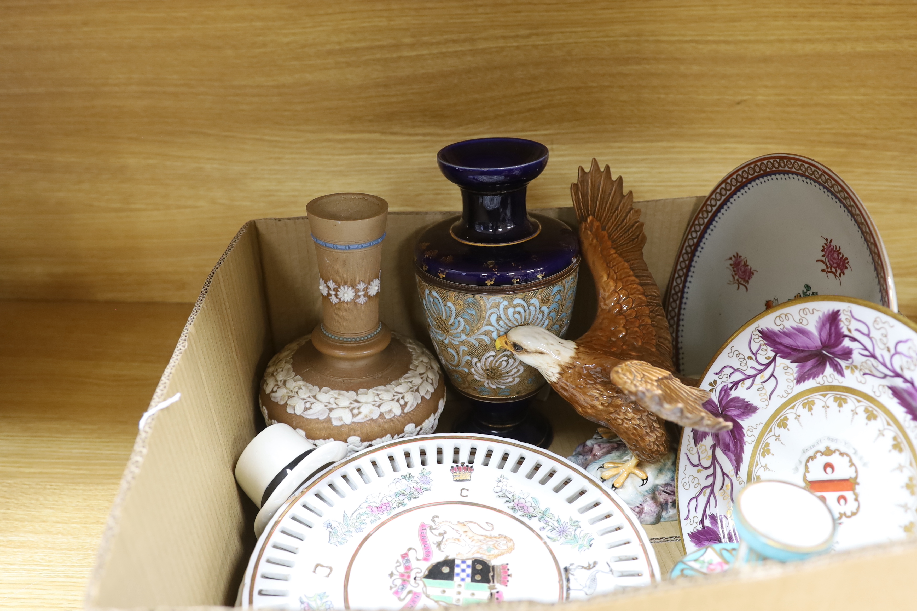 Two Doulton vases, a Beswick eagle, armorial plates, a vase and an advertising top hat